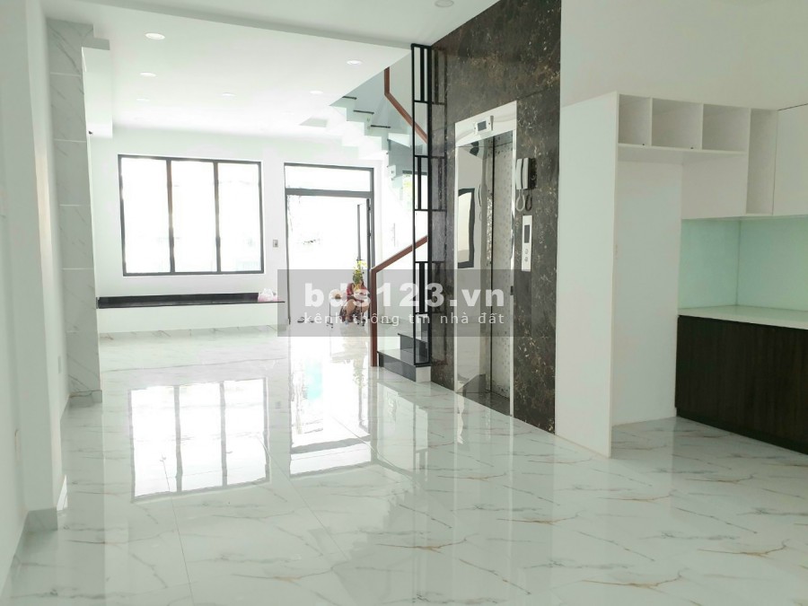 Bán nhà mặt tiền đường 25A Tân Quy 5x19 4 tầng thang máy