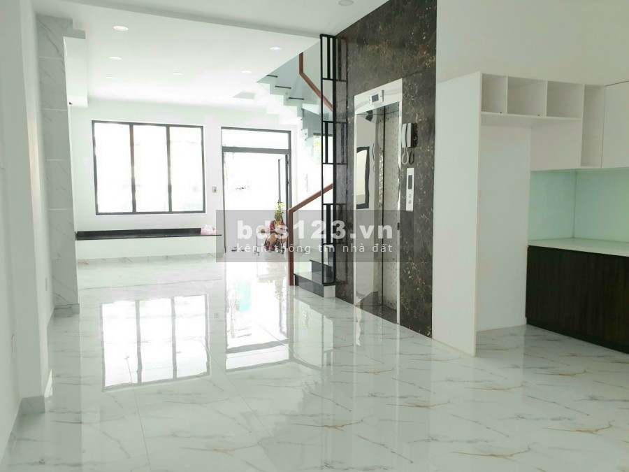 Bán nhà mặt tiền đường 25A Tân Quy 5x19 4 tầng thang máy