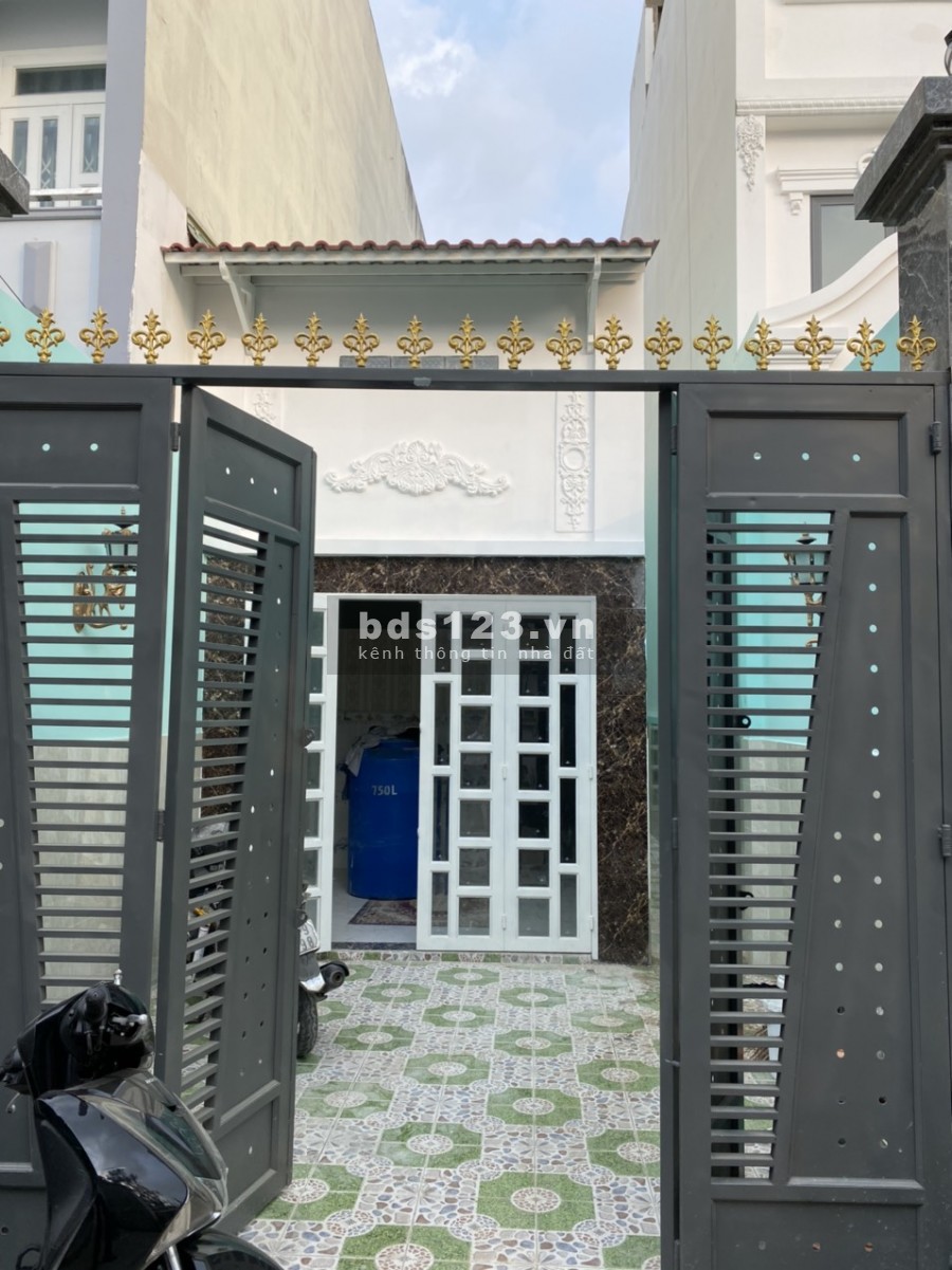 Nhà mới xây trệt + lầu xã Tân Kiên, Bình Chánh. DT 84m2, hẻm xe hơi, sổ hồng riêng.