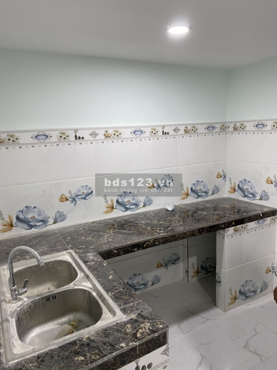 Nhà mới xây trệt + lầu xã Tân Kiên, Bình Chánh. DT 84m2, hẻm xe hơi, sổ hồng riêng.