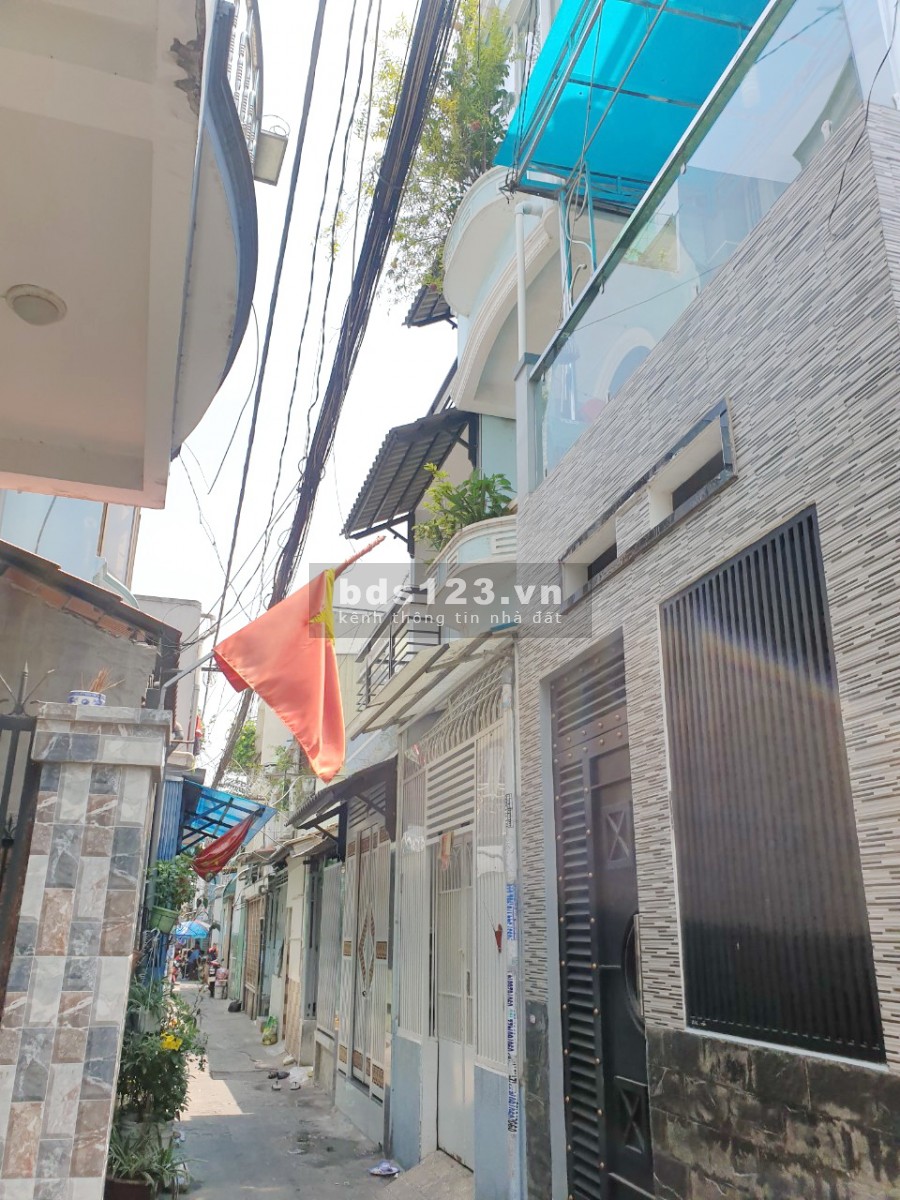 Nhà (2lầu/ST/nở hậu) hẻm 65 Bùi Huy Bích P13 Q8
