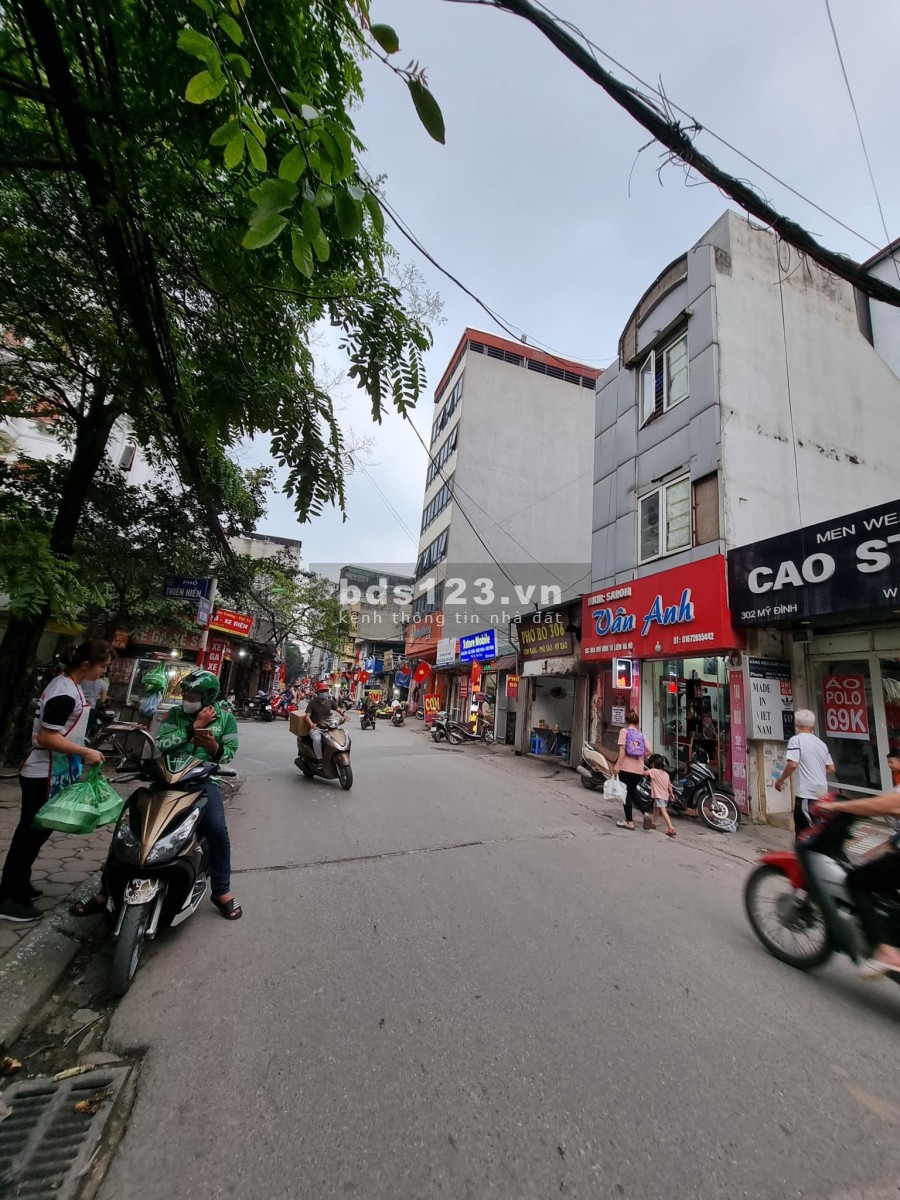Bán gấp! nhà mặt đường Mỹ Đình 124m2 x 4 tầng, lô góc, ô tô, kinh doanh, 24 tỷ.