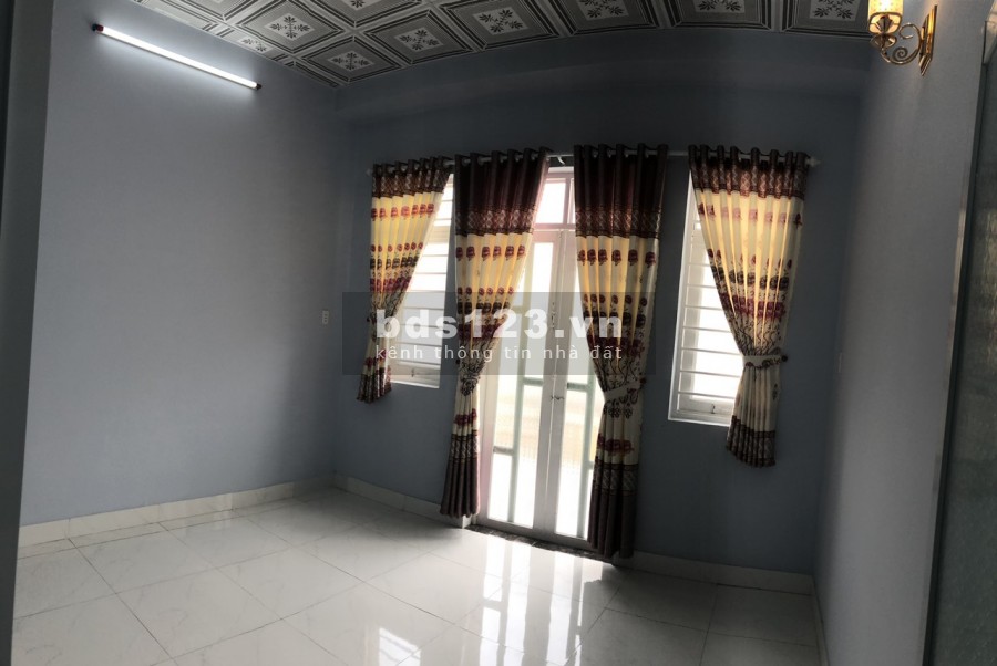 Nhà đúc kiên cố 1LẦU 2PN 100m2 đường thông,Bình Mỹ.