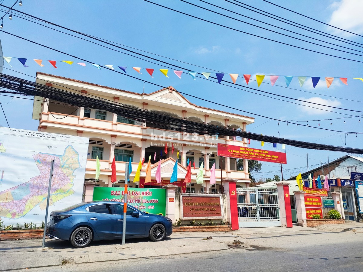 Cần bán gấp lô đất góc 2mt đường nhựa 12m 104,7 full thổ cư Phú Hòa Đông Củ Chi